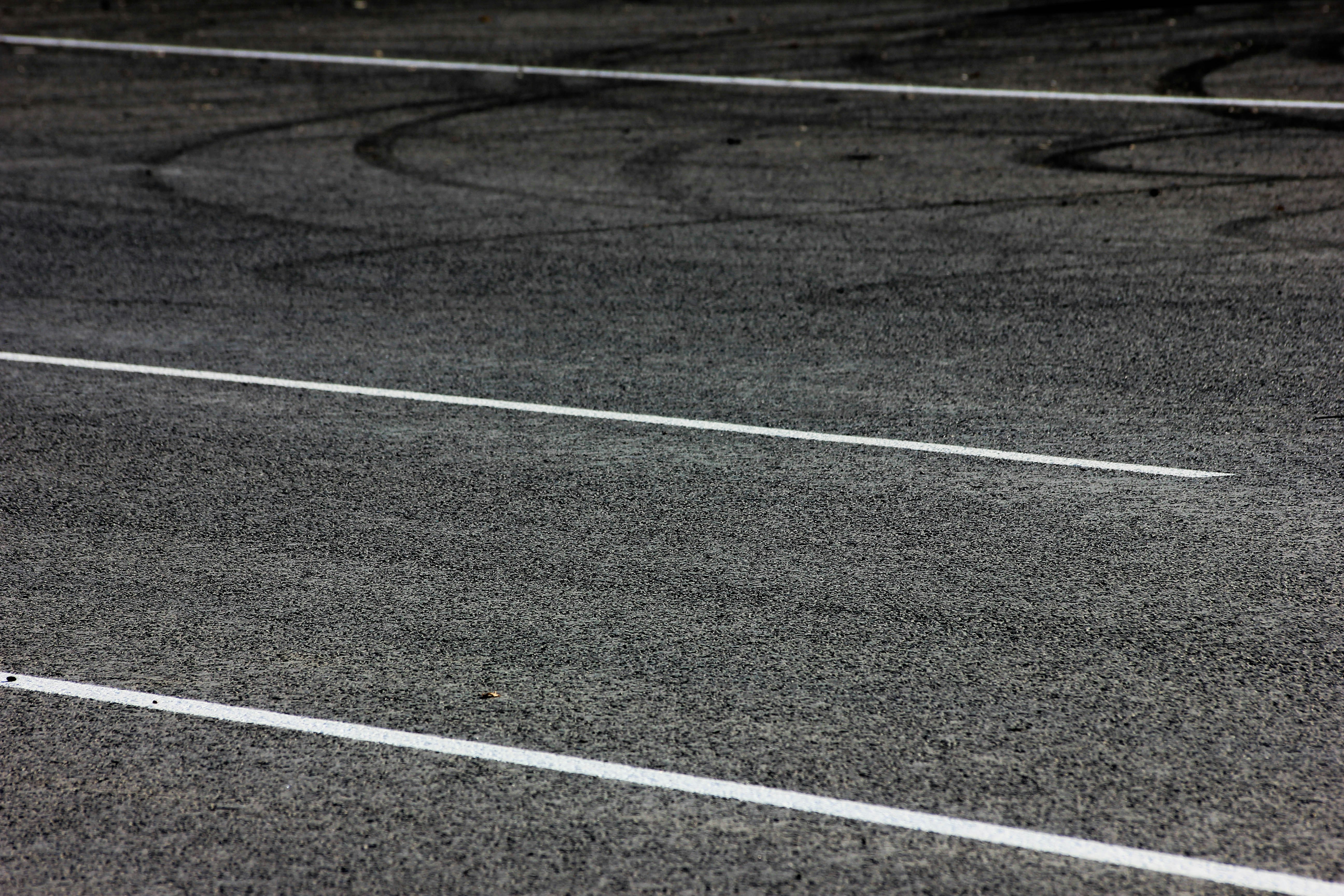 a black and white photo of a parking lot